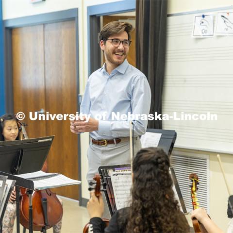 Dameer Gustafson, junior music education major, smiles during the second-year string class. UNL/LPS String Project. April 10, 2024. Photo by Kristen Labadie / University Communication.